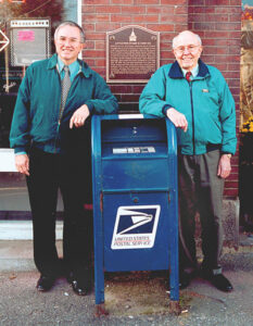 David and Maynard standing beside plaque - Littleton Coin Blog