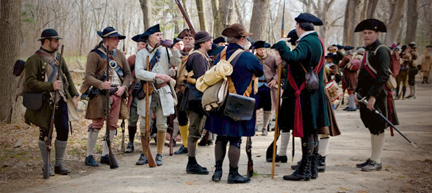 Minute Men preparing to fight the British troops on Battle Road in Concord, MA during the Patriots' Day celebration reenactment. 